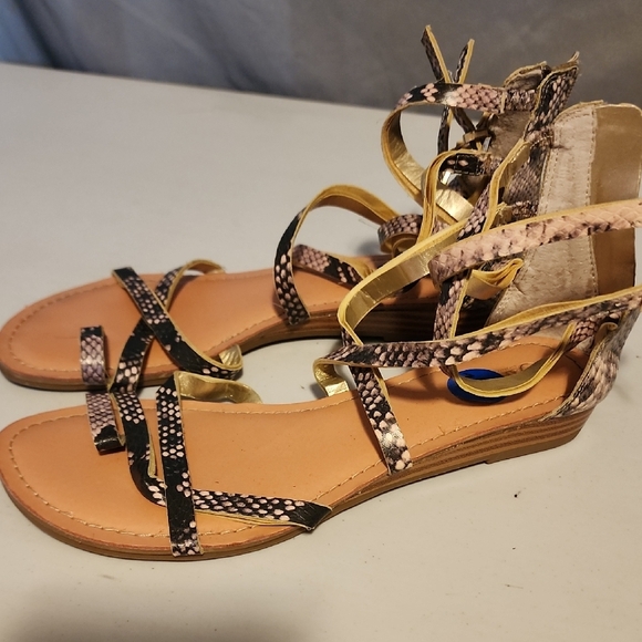 Black and Gold Gladiator Sandals with Metallic Buckles - Picture 1 of 6